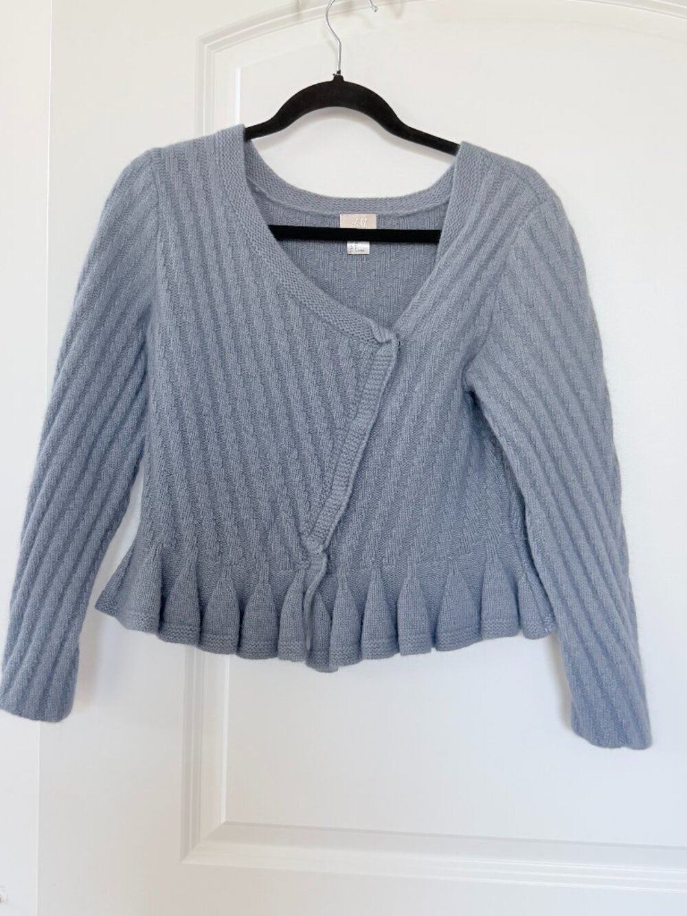 H&M Blue,  Size 6 ribbed knit cardigan with a diagonal button closure Peplum